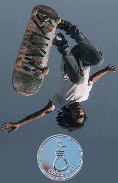 Skateboarder upside down and tarot coin